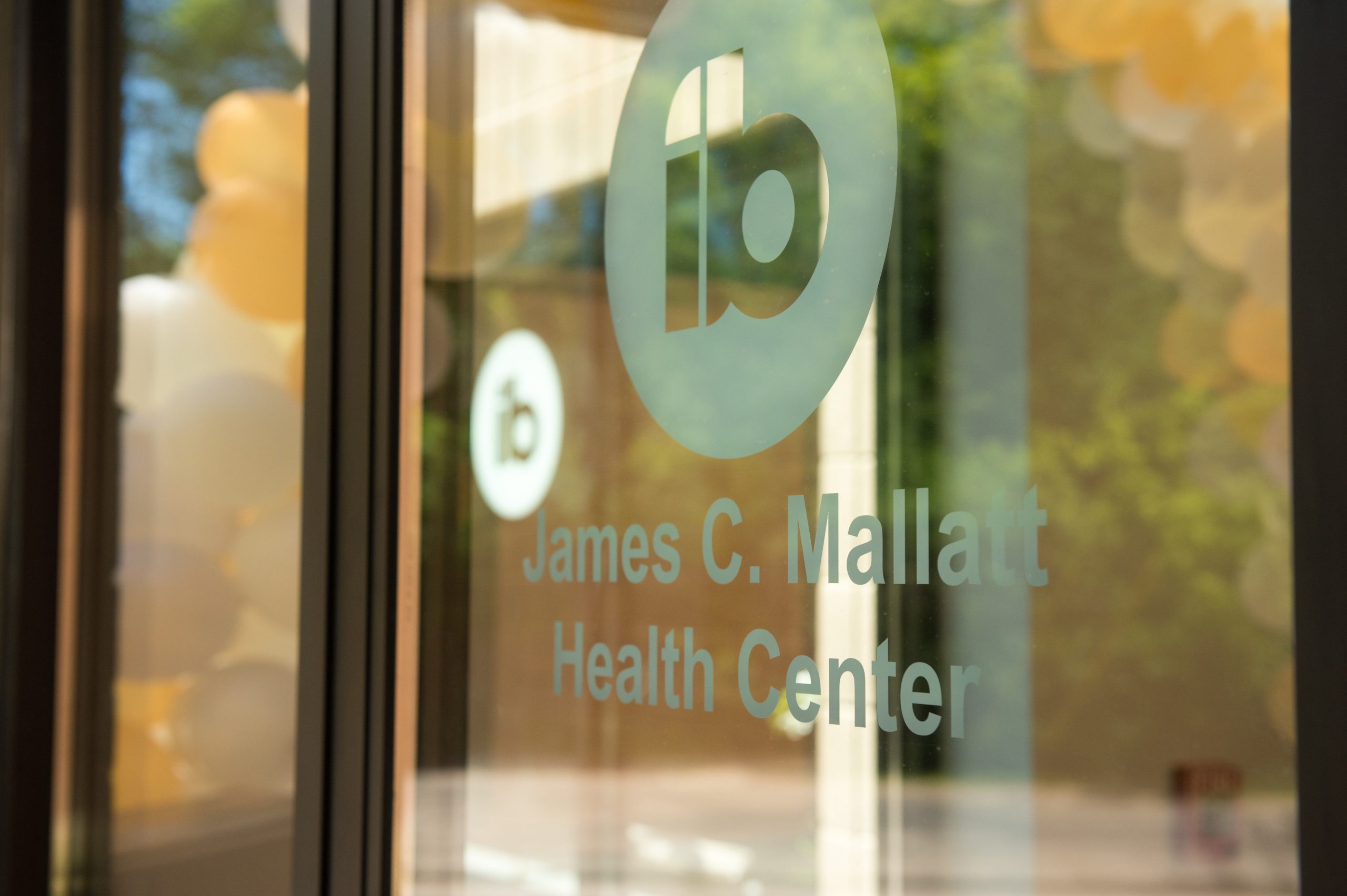 closeup of door that reads "James C. Mallatt Health Center"