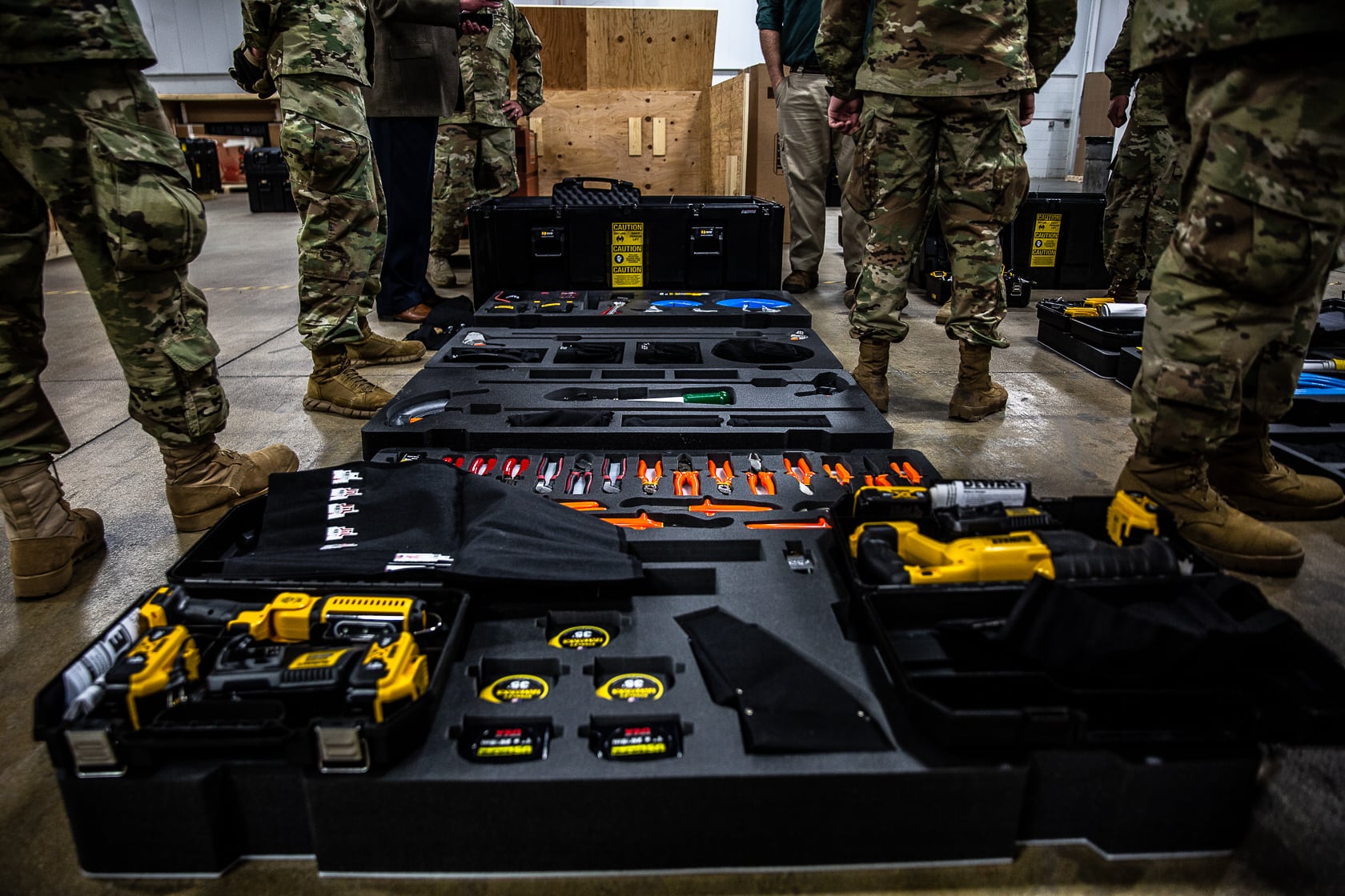 Military tool kits in black heavy duty totes