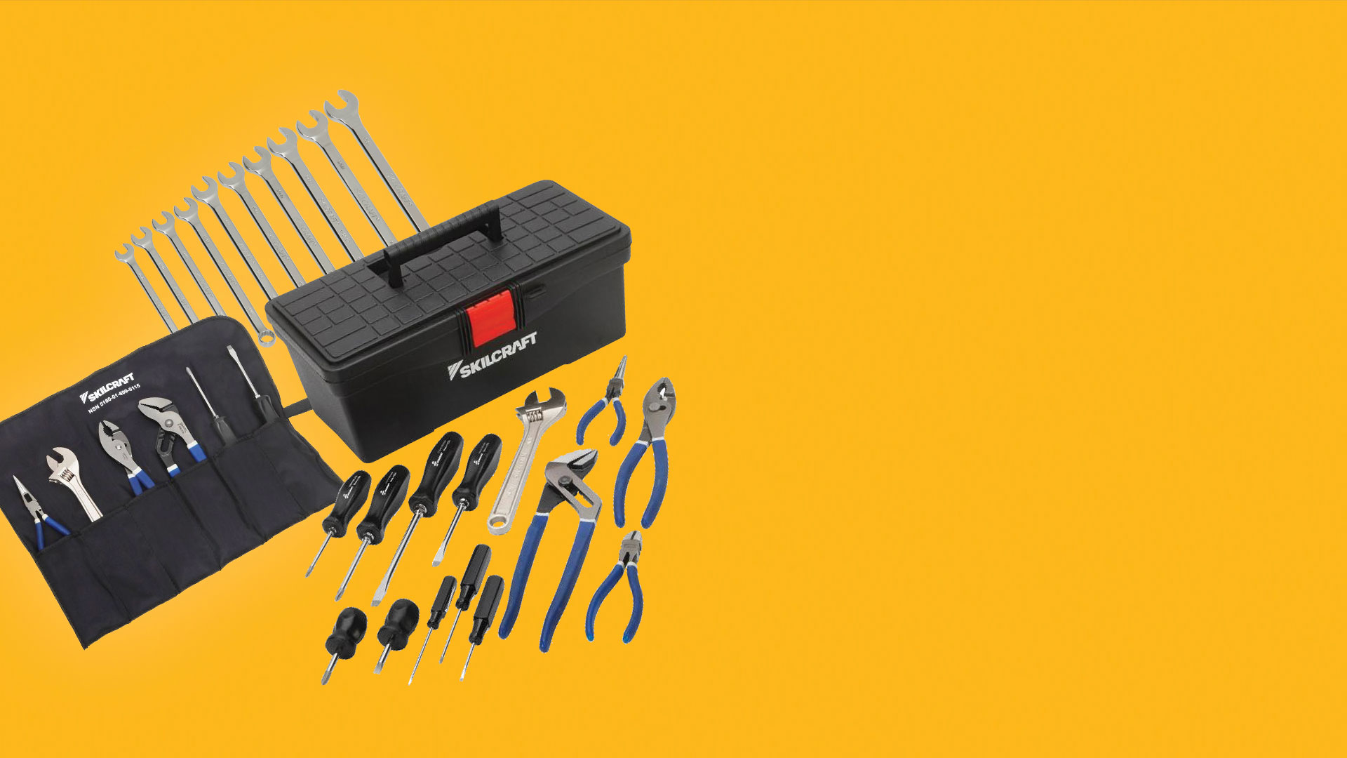 multiple sets of screw drivers, pliers, and wrenches next to a tool box and tool sleeve.