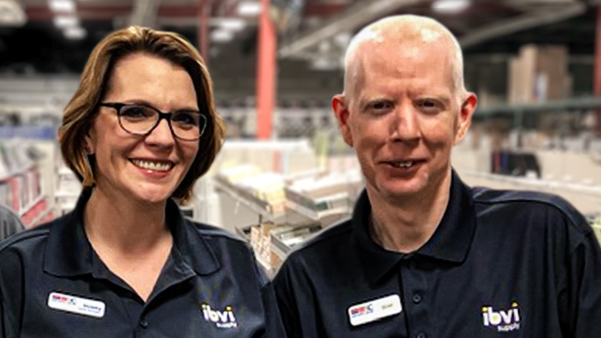 Two IBVI employees smiling