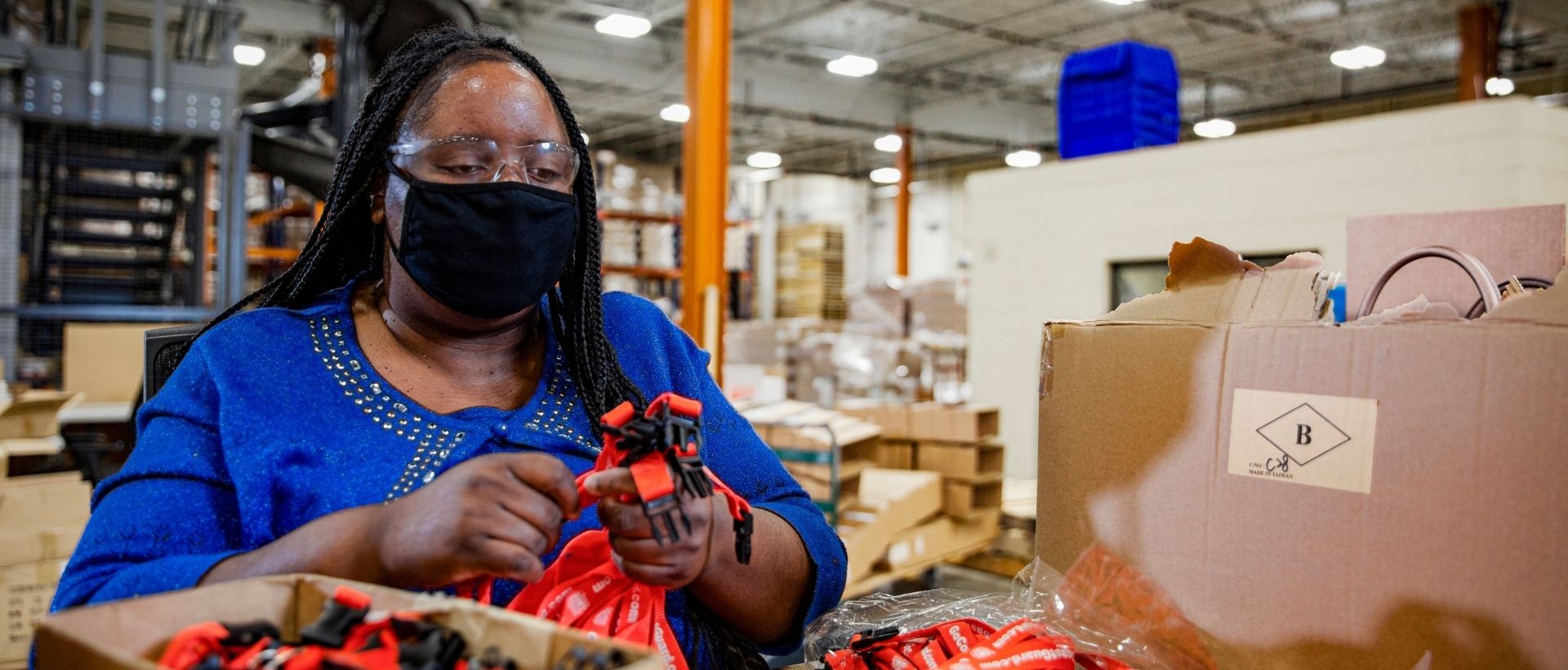 woman packaging items in a warehouse