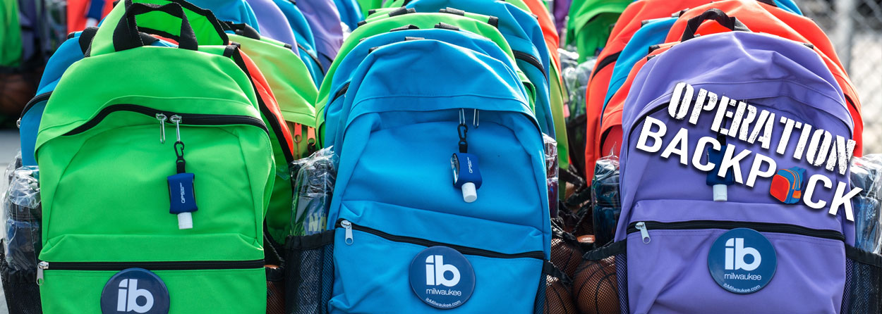 Rows of colored backpacks with text overlay reading "operation backpack"