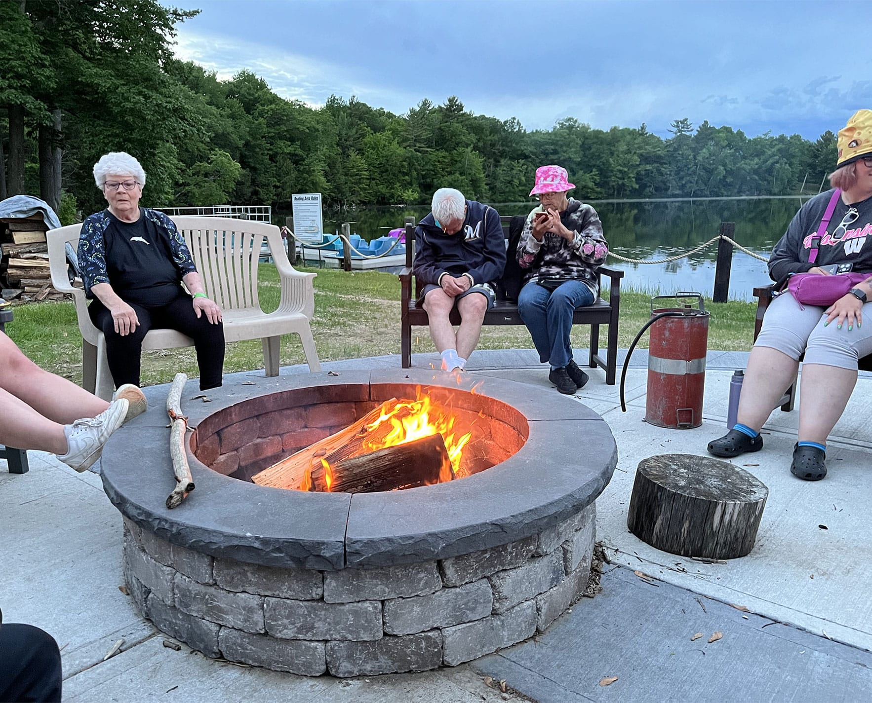 People sitting around a bonfire